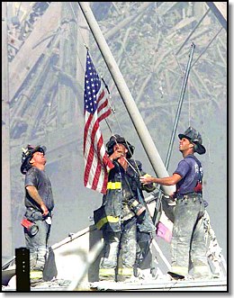 Firemen Rainsing The Flag Over Destroyed World Trade Center